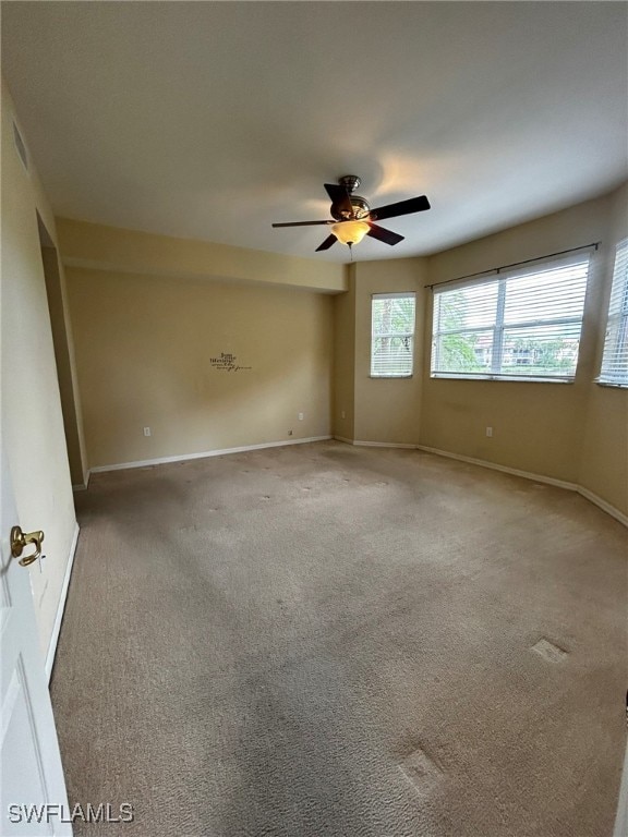 carpeted empty room with ceiling fan