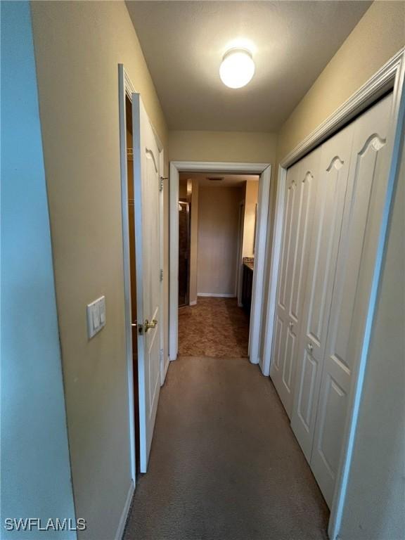 corridor featuring carpet flooring