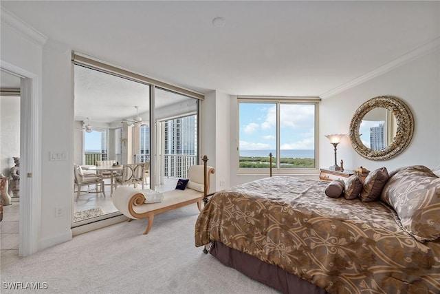 bedroom with floor to ceiling windows, light colored carpet, and ornamental molding