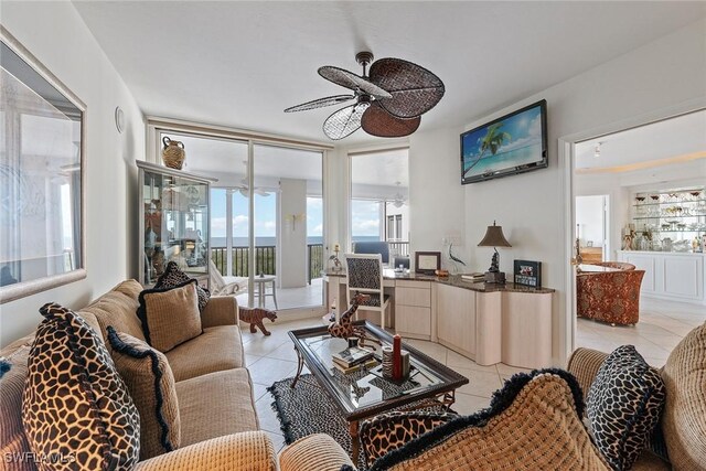 tiled living room featuring ceiling fan