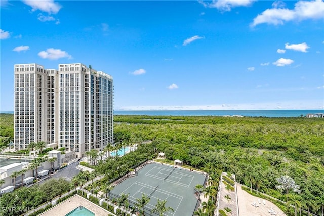 birds eye view of property with a water view