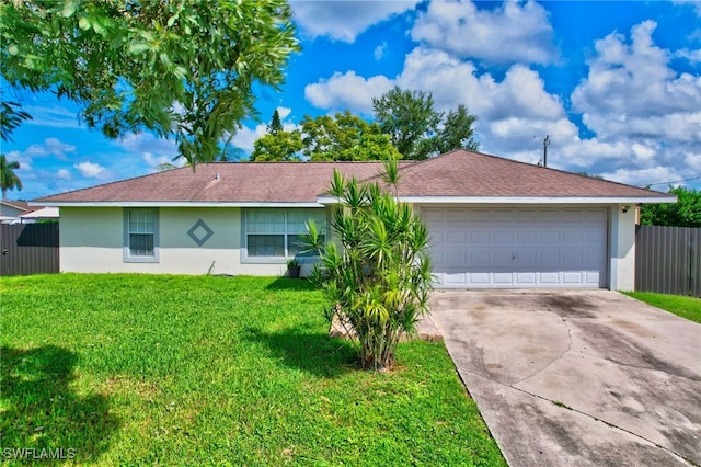 ranch-style home featuring a garage and a front yard