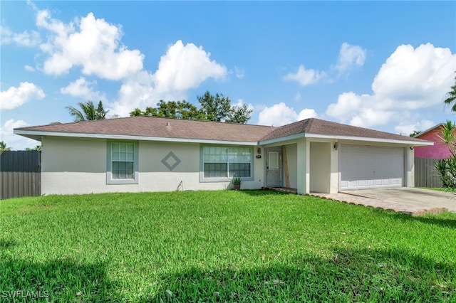 single story home featuring a front lawn and a garage