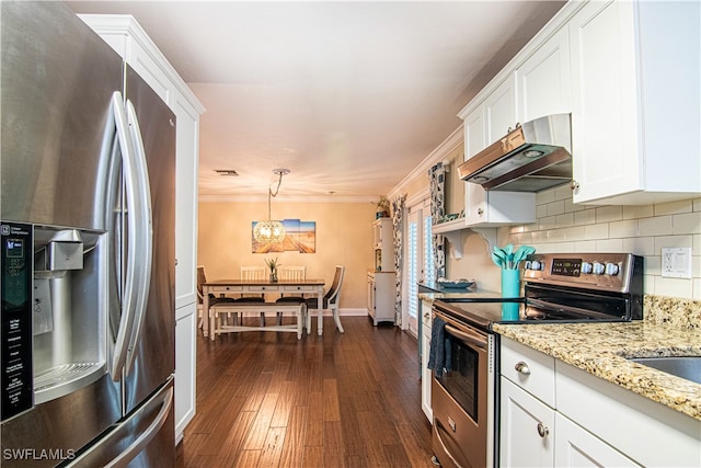 kitchen featuring appliances with stainless steel finishes, dark wood-type flooring, tasteful backsplash, white cabinetry, and pendant lighting