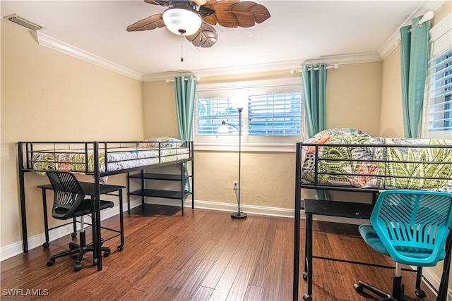 bedroom featuring ceiling fan, crown molding, and wood-type flooring