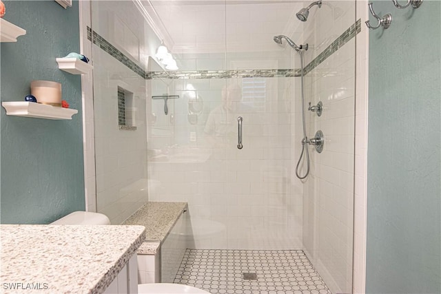 full bathroom featuring a textured wall, crown molding, a shower stall, and toilet