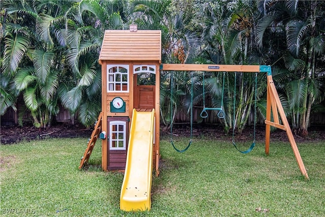 view of jungle gym featuring a lawn