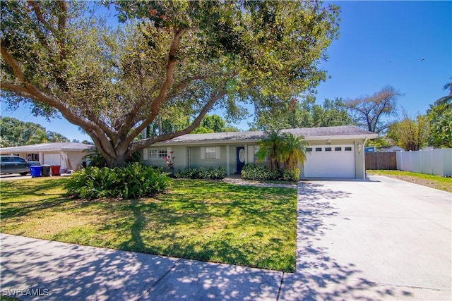 1316 Sunbury Dr, Fort Myers, FL 33901 - single story home with concrete driveway, a front lawn, fence, and a garage