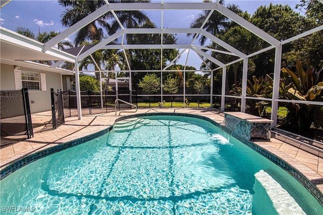 1316 Sunbury Dr, Fort Myers, FL 33901 - view of swimming pool featuring a fenced in pool, glass enclosure, and a patio