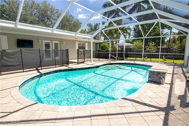 1316 Sunbury Dr, Fort Myers, FL 33901 - view of swimming pool featuring a fenced in pool, fence, a patio area, french doors, and a lanai