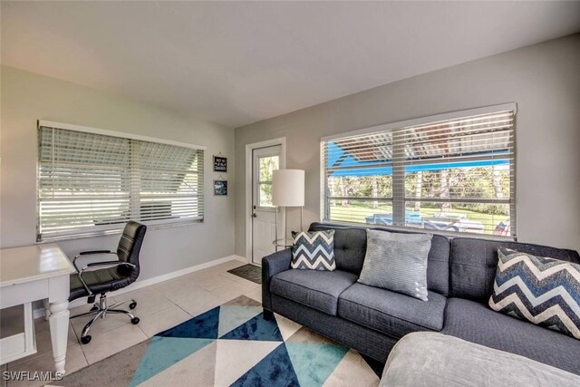 office space featuring a wealth of natural light and light tile patterned floors