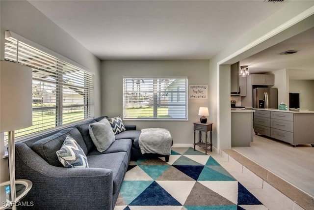 living room with light tile patterned flooring