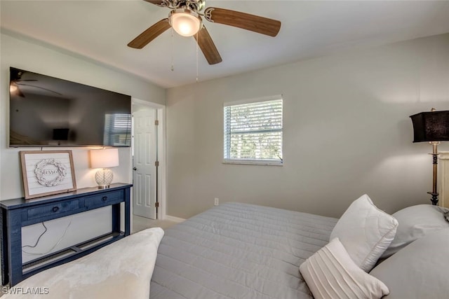 bedroom featuring ceiling fan and light carpet