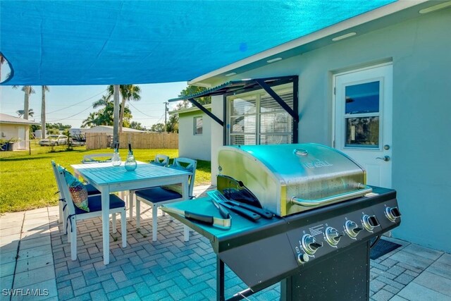 view of patio featuring a grill