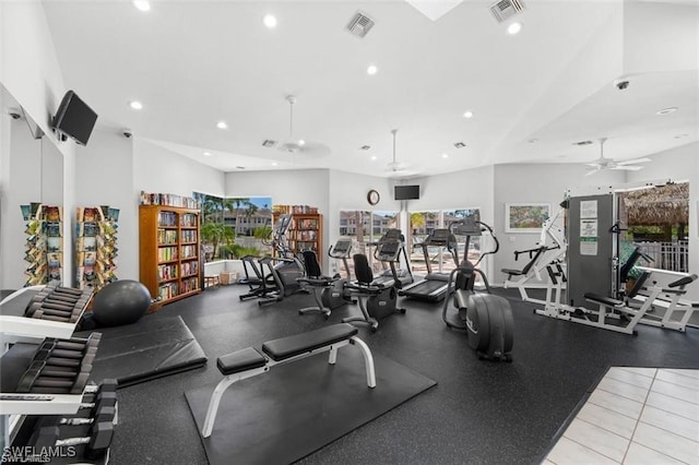 workout area featuring ceiling fan and light tile patterned floors