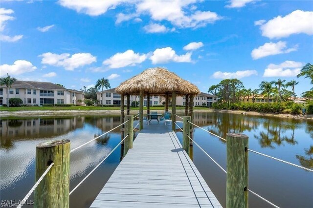 dock area with a gazebo and a water view