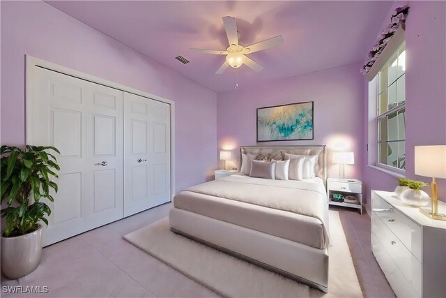 bedroom featuring ceiling fan and a closet