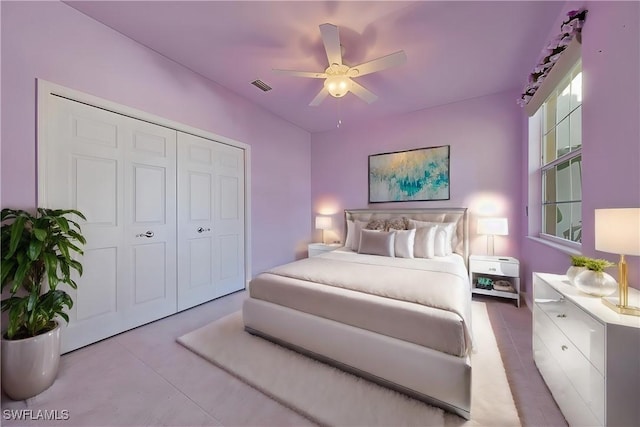 bedroom with a ceiling fan, a closet, and visible vents