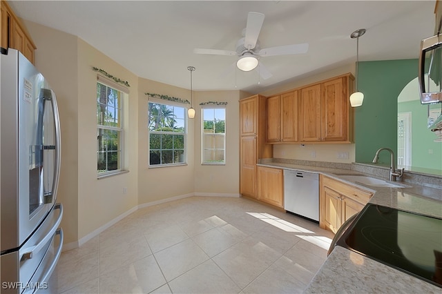 kitchen featuring light tile patterned floors, decorative light fixtures, dishwashing machine, ceiling fan, and refrigerator