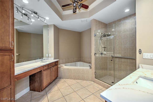 bathroom with independent shower and bath, double vanity, tile patterned flooring, ceiling fan, and a raised ceiling