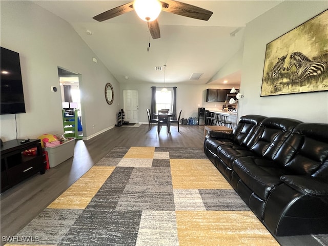 living room featuring ceiling fan, high vaulted ceiling, and dark wood-type flooring