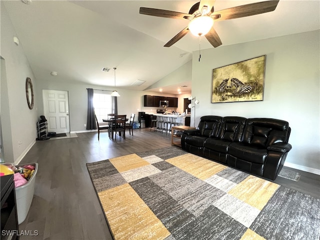 living room featuring hardwood / wood-style floors, ceiling fan, and lofted ceiling