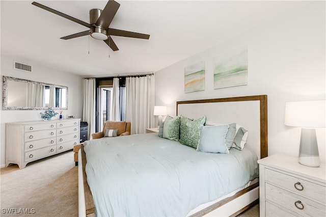 bedroom with ceiling fan and light carpet