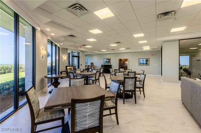 dining room featuring a paneled ceiling