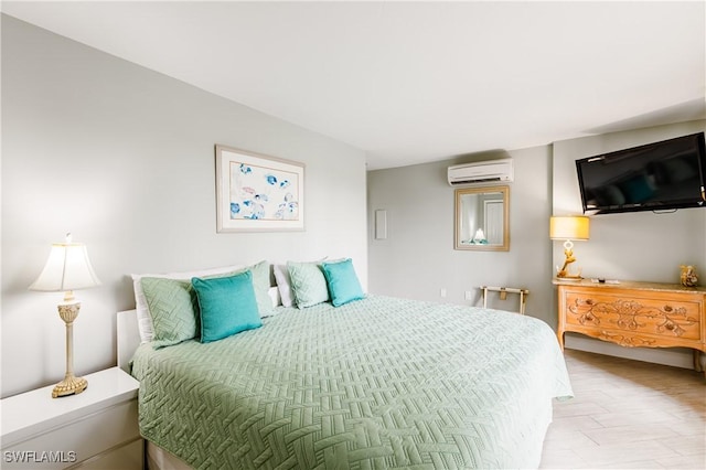 bedroom featuring a wall mounted air conditioner