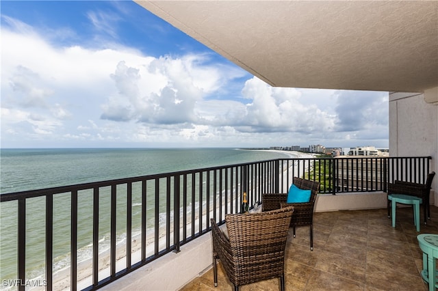 balcony featuring a water view