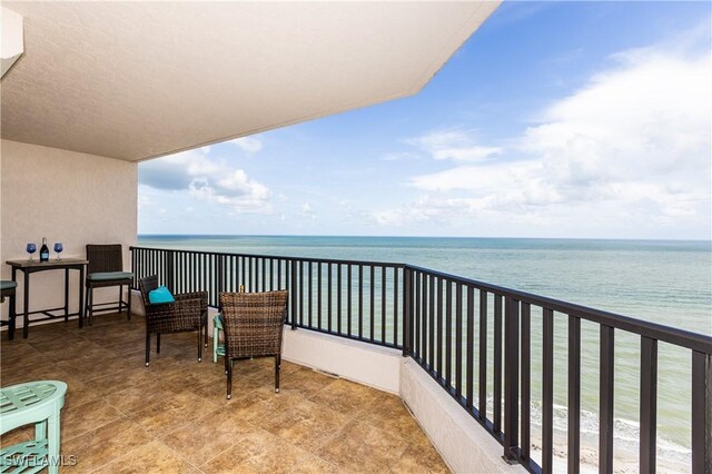 balcony featuring a water view