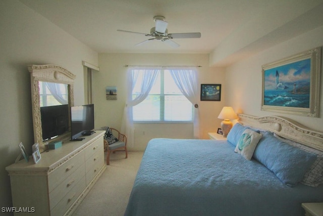 bedroom featuring ceiling fan and light carpet