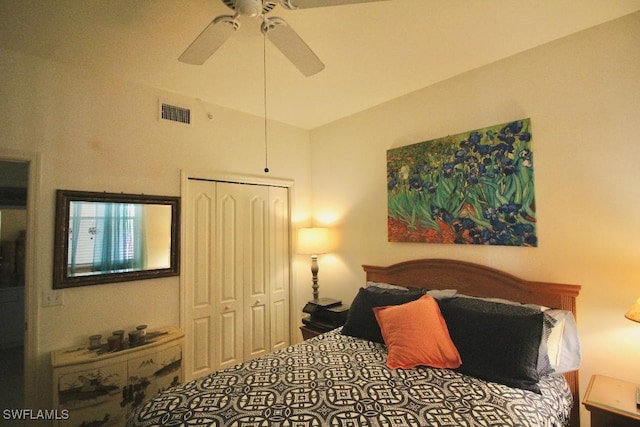 bedroom featuring lofted ceiling, a closet, and ceiling fan