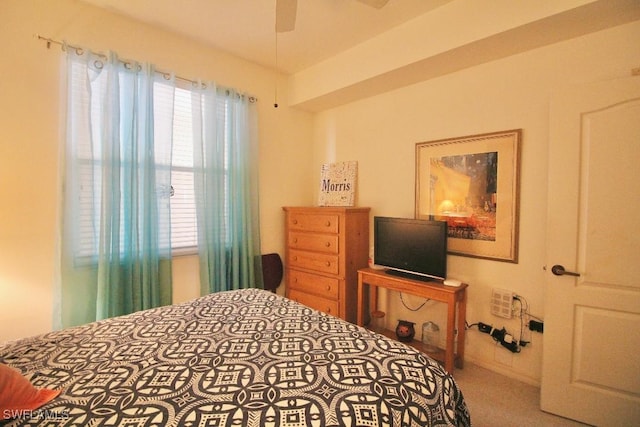 bedroom with carpet flooring, multiple windows, and ceiling fan