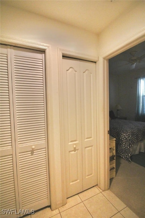 hallway featuring light tile patterned flooring