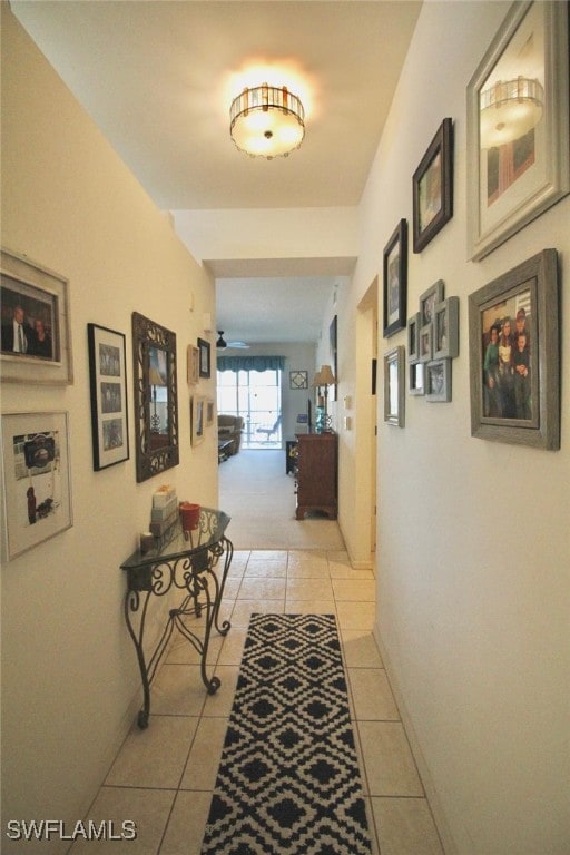 hall featuring light tile patterned floors