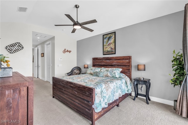 carpeted bedroom featuring ceiling fan and vaulted ceiling