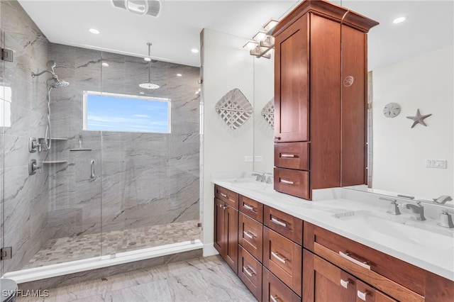 bathroom featuring vanity and a shower with shower door