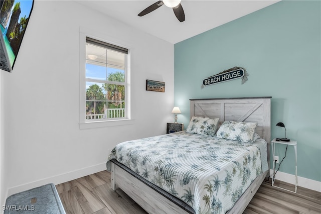 bedroom with ceiling fan and light wood-type flooring