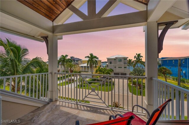 view of balcony at dusk