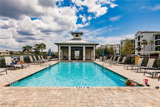 view of swimming pool with a patio area