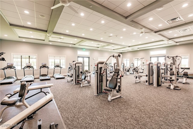 exercise room featuring ceiling fan, coffered ceiling, and carpet flooring