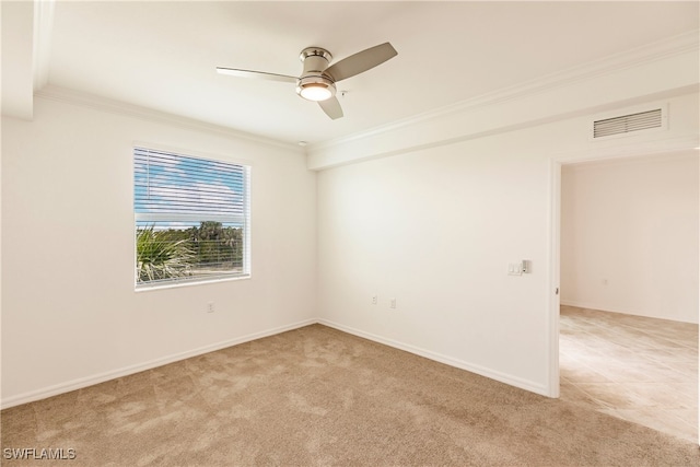 unfurnished room with ceiling fan, ornamental molding, and light colored carpet