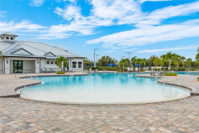 view of swimming pool with a patio area