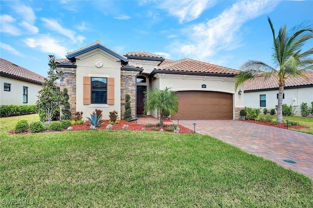 mediterranean / spanish-style home with a garage and a front lawn