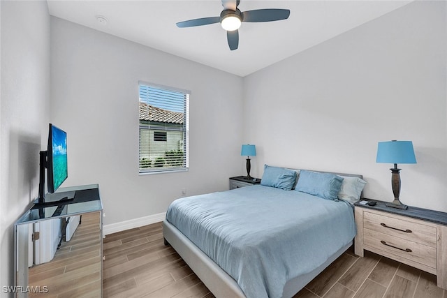 bedroom featuring ceiling fan and hardwood / wood-style floors