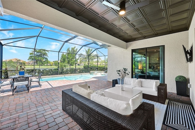 view of patio / terrace with glass enclosure and an outdoor living space