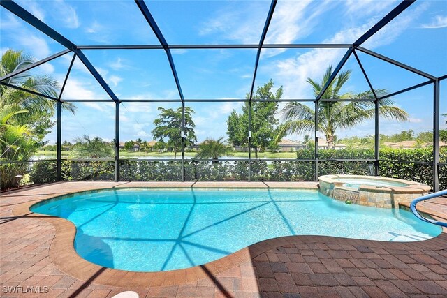 view of swimming pool with an in ground hot tub and a lanai