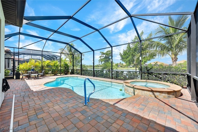 view of swimming pool featuring an in ground hot tub, glass enclosure, and a patio area