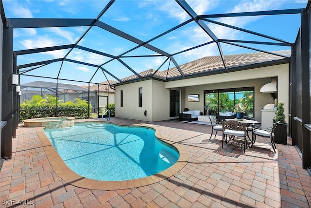 view of pool with a patio area, an in ground hot tub, and a lanai